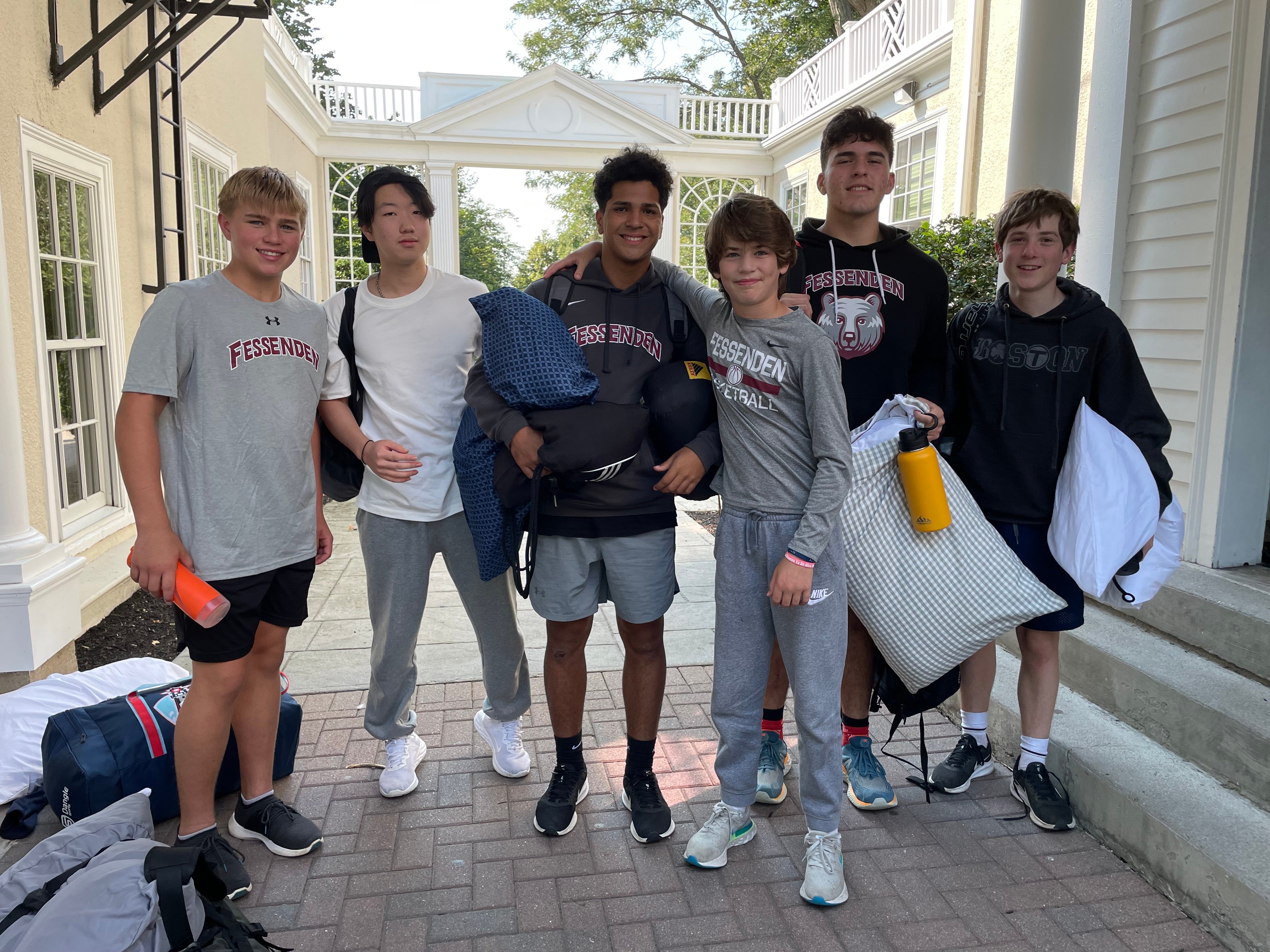 Six junior boarding school students at The Fessenden School in West Newton, MA, taking a picture together.