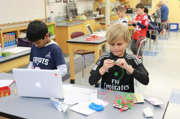 Elementary students in a science classroom learning how to code at Fessenden private school in Massachusetts.