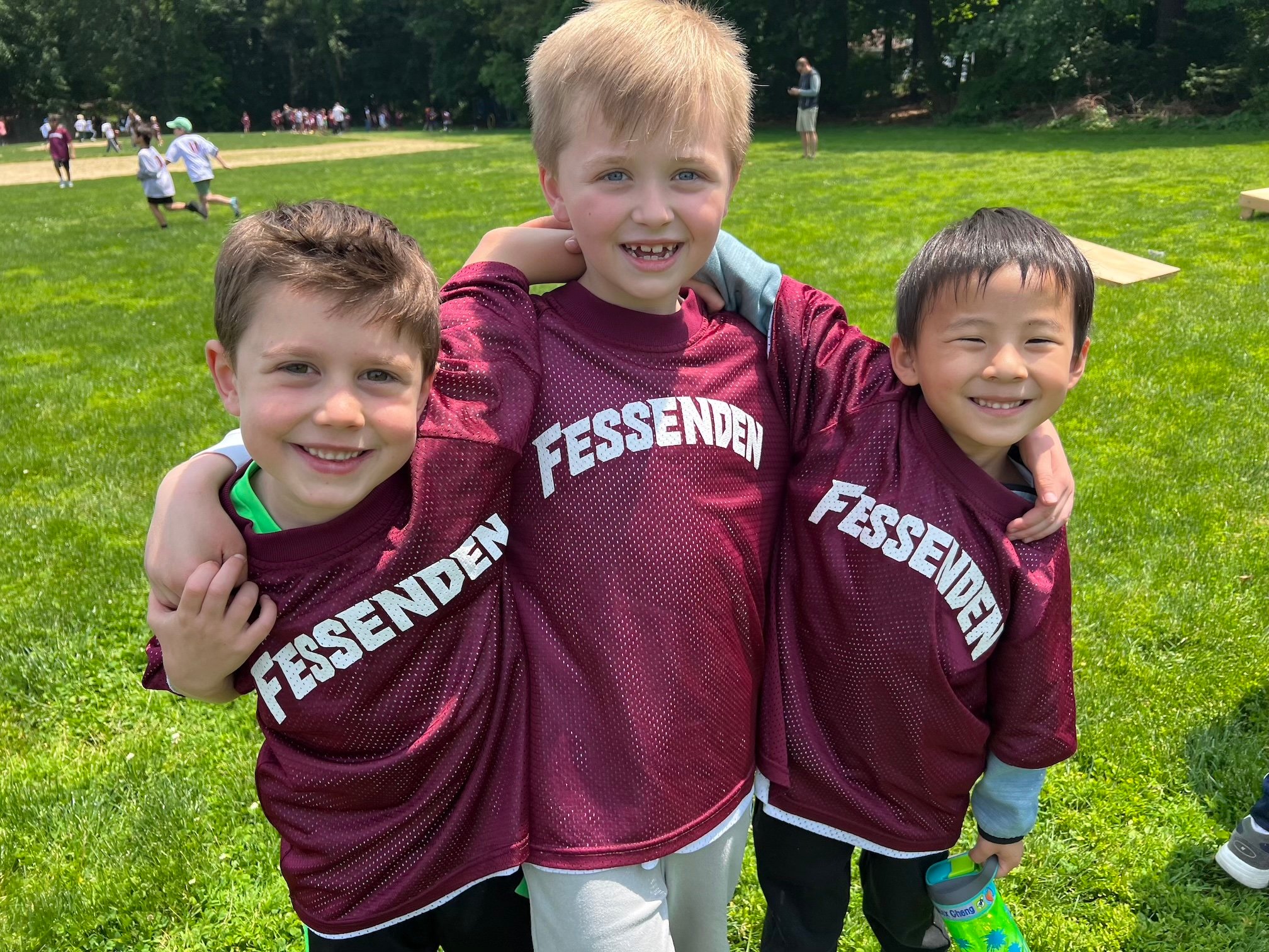 Three Fessenden students taking a picture together outside during PE class.