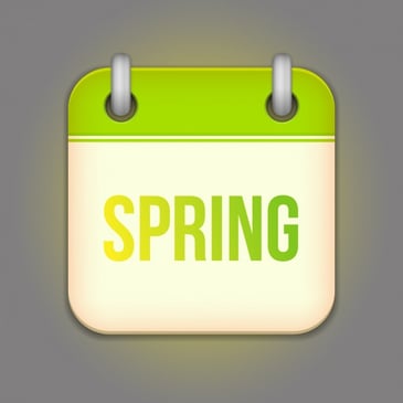 A cartoon calendar in green and white that has the word “Spring” in it which is referencing the season.