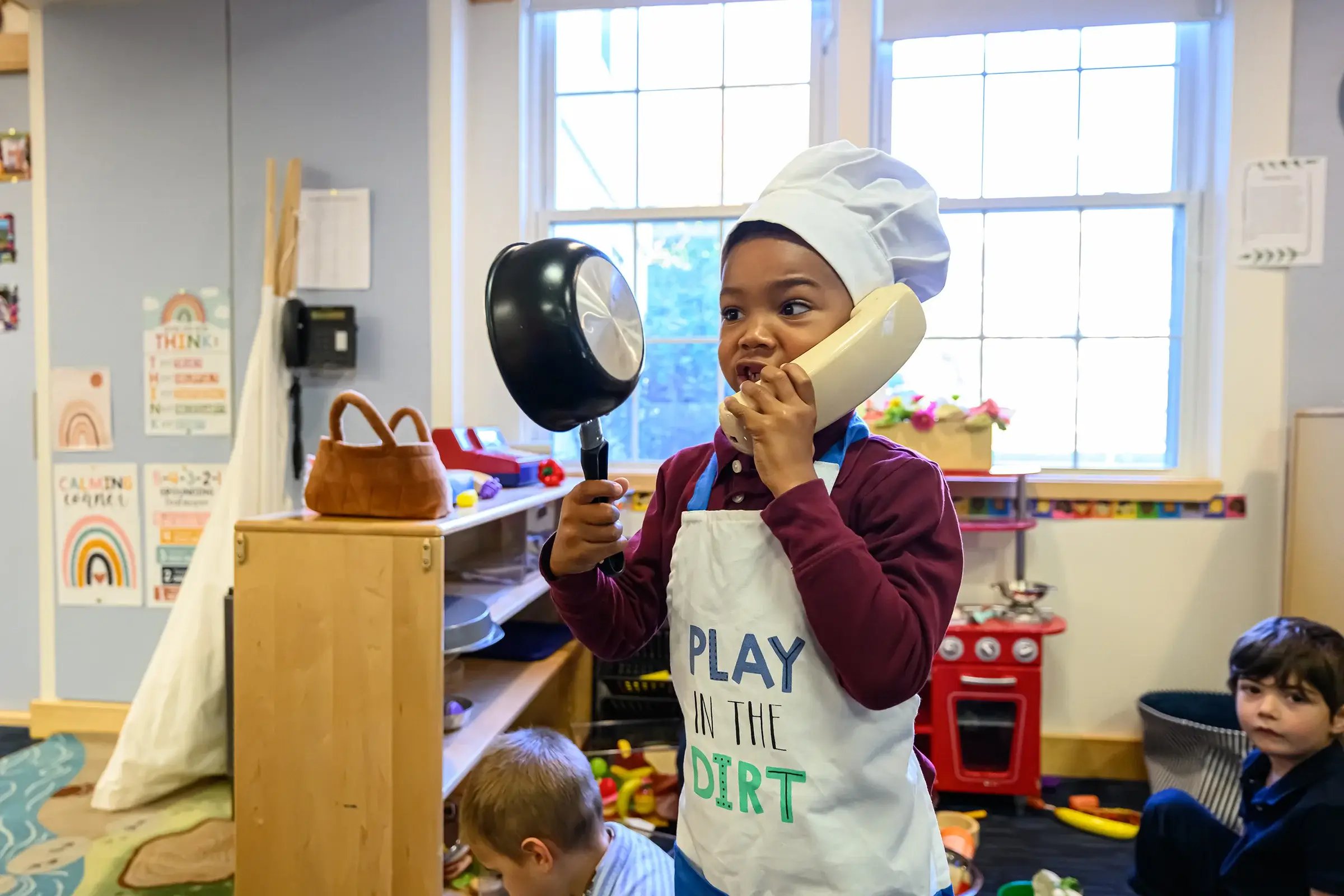 Young boy wearing a chef hat